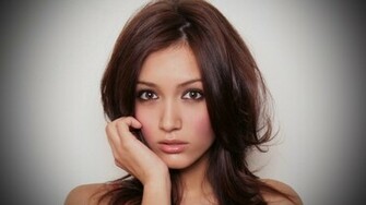 Misa Campo With A Hand On Her Face Wallpaper