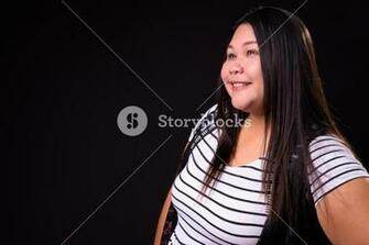 Beautiful Overweight Asian Woman Against Black Background Royalty