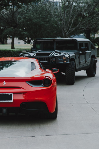Red Ferrari Car And Black Hummer Suv Photo Background