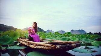 Girl Sitting In The Boat Wallpaper