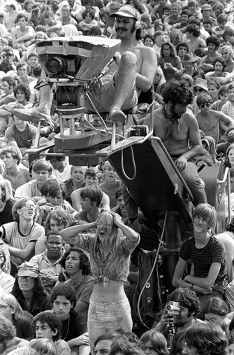 Baron Wolman Woodstock Cameraman In Crowd At