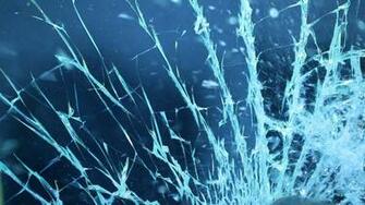 Shattering Glass On Blue Background Breaking Window Screen