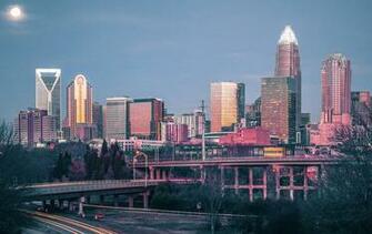 Early Morning Sunrise Over Charlotte Nc With Moon In Background