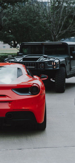 The Red Ferrari Car And Black Hummer Suv Wallpaper