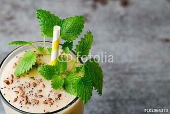 Banana And Lemon Smoothie On The Grey Background Stock Photo