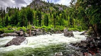 Rushing Stream Under Mountain Wallpaper In Nature