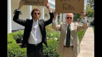 Joe Biden Holds Up Placard With Dude Sign To Spread