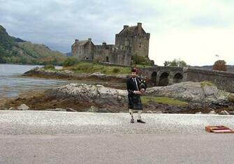 A Piper S Welcome To Eilean Donan Castle Wallpaper Other