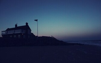 Beach House At Night Wallpaper Stock Photos