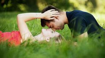 Stylish With Romantic Couple Kiss On Grass Love Wallpaper