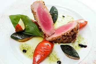 Appetizing Tuna Steak With Vegetables On A White Plate