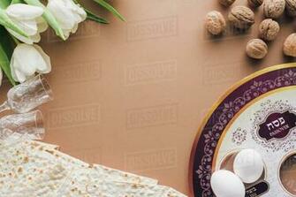 Top Of Traditional Jewish Plate And Matzah On Beige Table