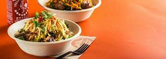 Shophouse Kitchen Bowl With Sriracha Sauce In Background Food