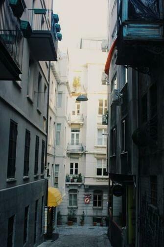 Pathway Between Buildings At Daytime HD Wallpaper In