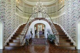 Story Entrance Foyer With Hard Wood Floors Table And Half Landing