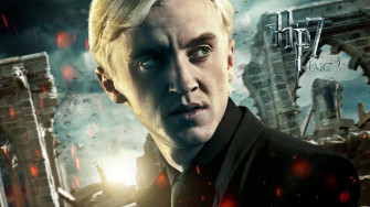 Draco Malfoy Is Facing One Side In Broken Building Background Wearing Wallpaper