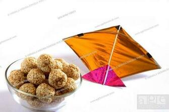 Sweet Tilgur Or Til Gul Sesame Laddoos In Bowl With Kite On White