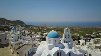 Aerial Footage Of A Church And Cliffside Village In Santorini