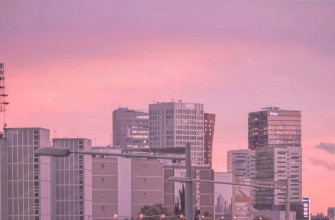 Image A Modern City With Pink Glow Wallpaper