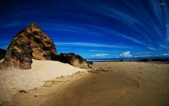Rock On Sandy Beach Wallpaper
