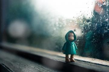 Wallpaper Id A Little Figure Toy Sitting In Front Of