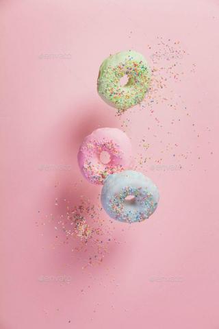 Sweet And Colourful Doughnuts With Sprinkles Falling Or Flying I