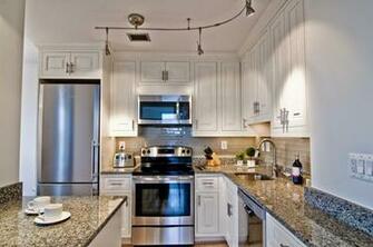New Caledonia Granite White Cabinets Wallpaper Home