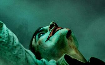 Wallpaper Of Joaquin Phoenix Joker Poster Background