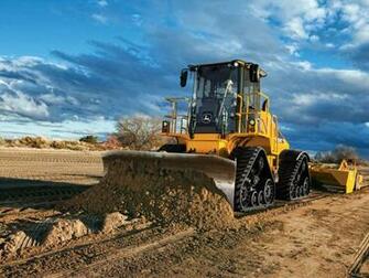 Brown Dirt The Blue Sky And John Deere Construction Yellow
