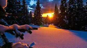 Fresh Snow And Pink Alpenglow Light At Sunset In Mountains