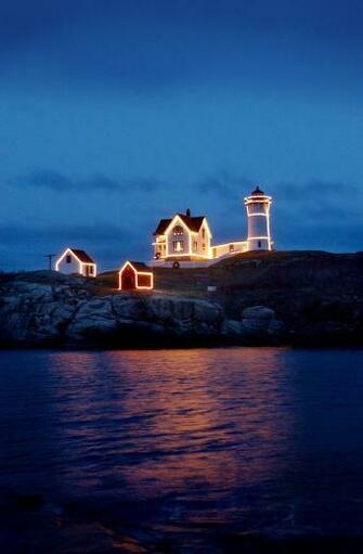 The Lighting Of Nubble Lighthouse In York Beach Maine Truly