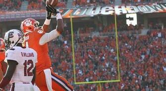Clemson Quarterback Deshaun Watson Tosses A Football To Referee Like