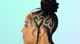 A Woman With Braids In Her Hair Wallpaper