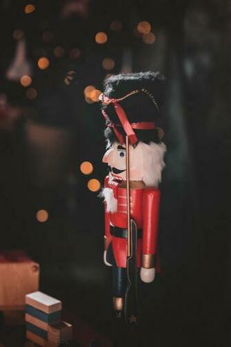Red And Black Nutcracker Figurine In Closeup Photo