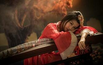 Geisha Leaning On The Instrument HD Desktop Wallpaper
