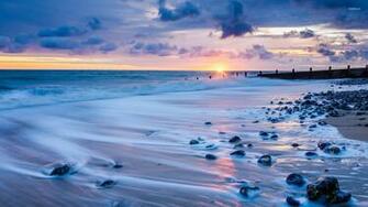 Rocks On A Sandy Beach Wallpaper
