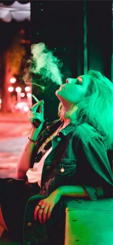 Woman Smoking During Nighttime iPhone Wallpaper