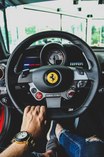 Person Driving Ferrari Vehicle Photo Car Image