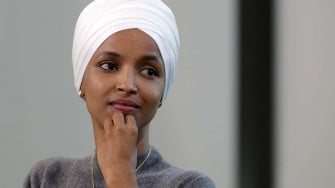 Us Representative Ilhan Omar Posing With A Contemplative Wallpaper