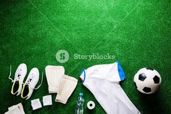 Soccer Ball Cleats And Various Football Stuff Against Artificial