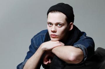 Young Actor Bill Skarsg Rd In A Black Hat Desktop Wallpaper