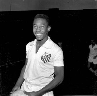 Amazon Smiling In A White Santos Jersey Set Against Dark