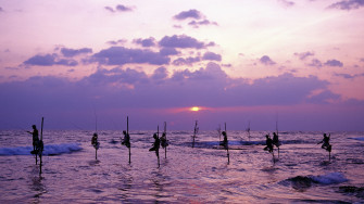 Stunning Fisherman At Dusk Wallpaper