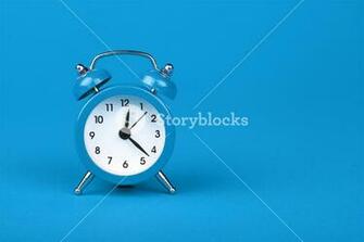 Close Up One Small Blue Metal Twin Bell Retro Alarm Clock Over
