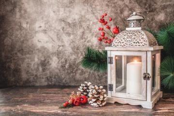 White Pillar Candle In Lantern Beside Wall Photo Image On