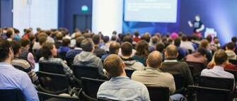 Abstract Blurred Photo Of Conference Hall Or Seminar Room With