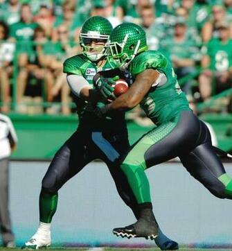 Saskatchewan Roughriders Quarterback Tino Sunseri Hands Off To