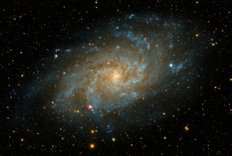 4k Spiral Galaxy With Red Yellow Blue Stars Wallpaper