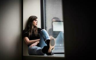 Hailee Steinfeld Sitting Near Window In Black Wallpaper HD